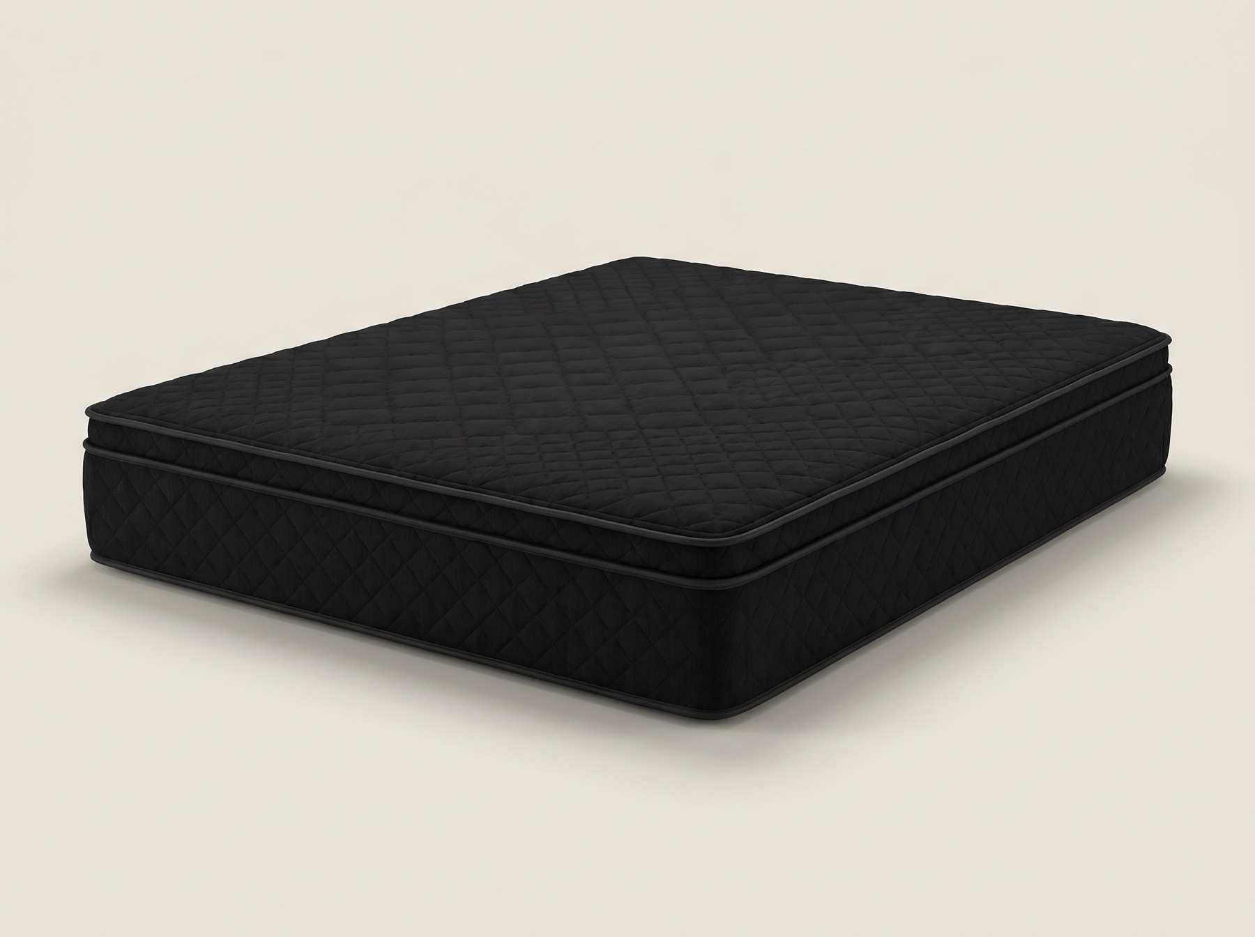 All-black quilted queen mattress on a bright light studio backdrop, clearly showing the black fabric